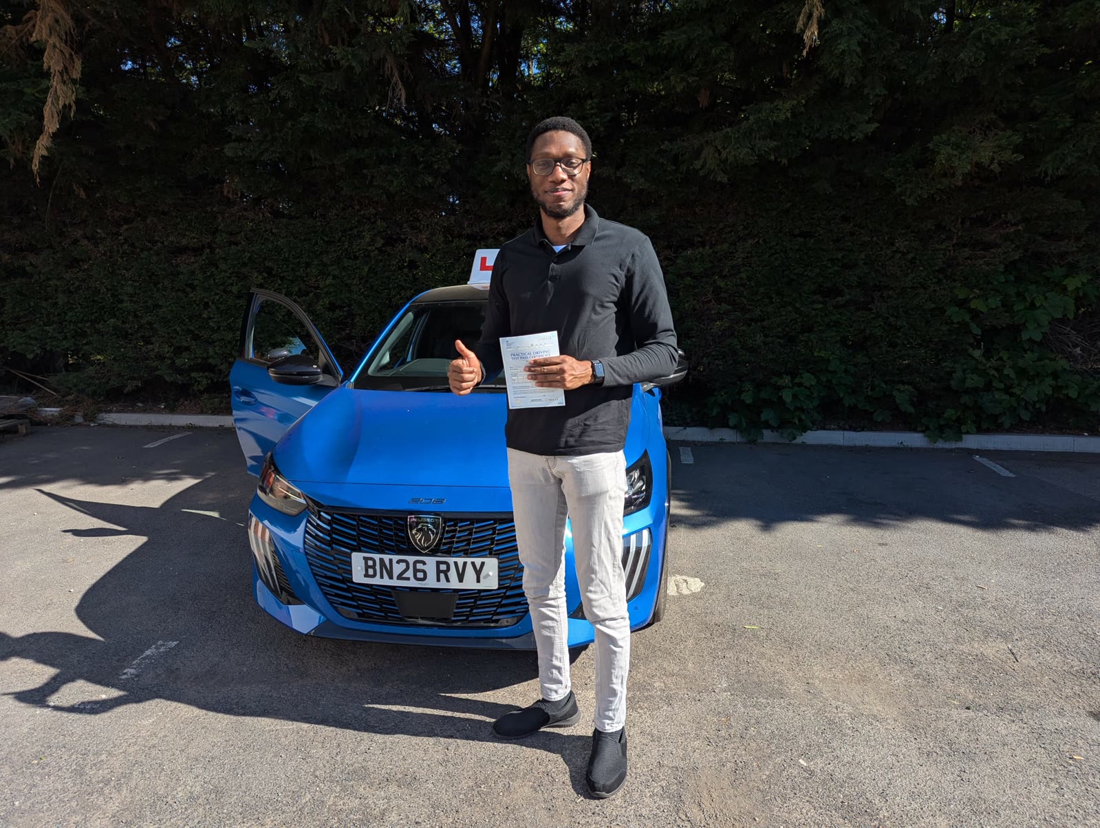 The blue Peugeot 208 GT used for manual driving lessons